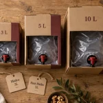 Bag in box vin cissac-médoc : 3L 5L 10L sur table bois
